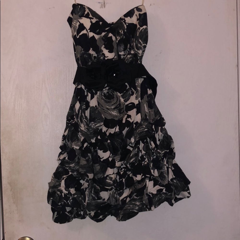 It’s a black and white strapless dress. Size 3